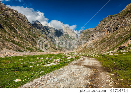 Dirt road in Himalayas. 62714714
