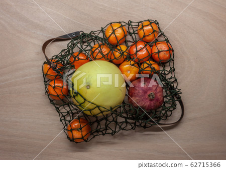 exotic fruits in green net bag zero waste concept 62715366