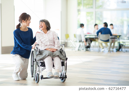 Senior woman and medical worker 62716477