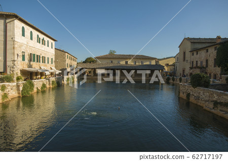 Ancient village Bagno Vignoni in Tuscany - Italy. 62717197