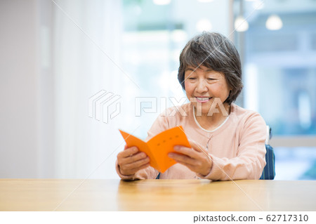 Senior woman with pension handbook Senior woman with pension handbook 62717310