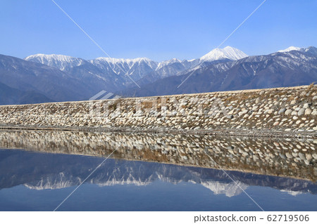 Azumino in early spring: Mansui River and the Northern Alps Azumino in early spring: Mansui River and the Northern Alps 62719506