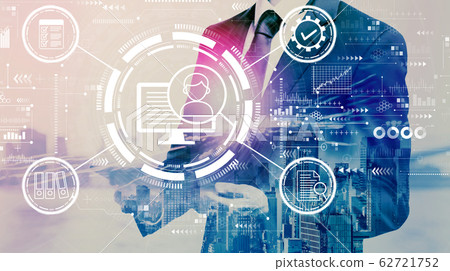 Document management system concept with businessman holding a tablet Document management system concept with businessman holding a tablet 62721752