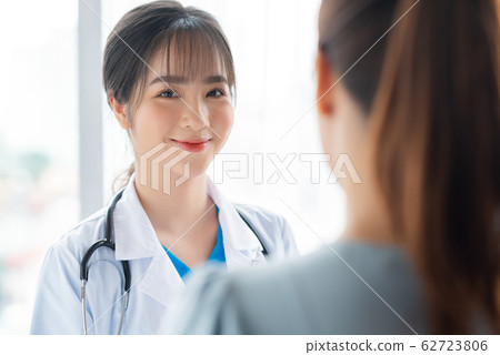 a woman doctor talking with her patient 62723806