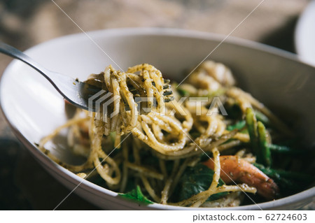 Pesto Spaghetti with shimp in high contrast italian food Pesto Spaghetti with shimp in high contrast italian food 62724603
