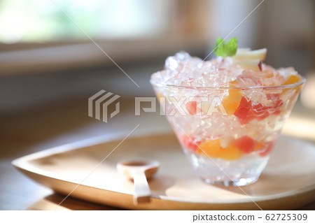 Japanese dessert jelly with fruit on wood plate Japanese dessert jelly with fruit on wood plate 62725309