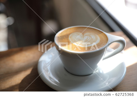 cappuccino or Latte art coffee made from milk on the wood table in coffee shop cappuccino or Latte art coffee made from milk on the wood table in coffee shop 62725368