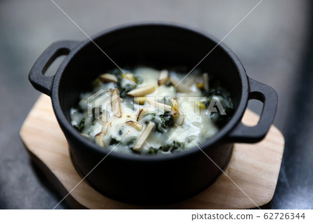 Spinach Cheese Bake on wooden plate apptizer 62726344