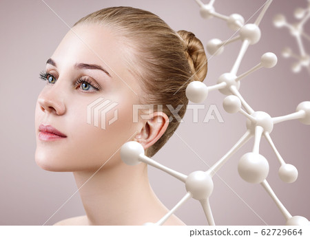 Young woman with big white molecule chain. Young woman with big white molecule chain. 62729664
