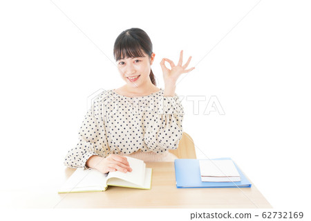 Young woman studying at desk Young woman studying at desk 62732169