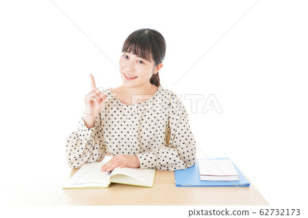 Young woman studying at desk Young woman studying at desk 62732173