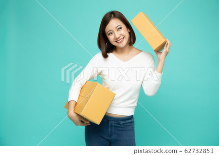 Happy Asian woman holding package parcel box, Happy Asian woman holding package parcel box, 62732851