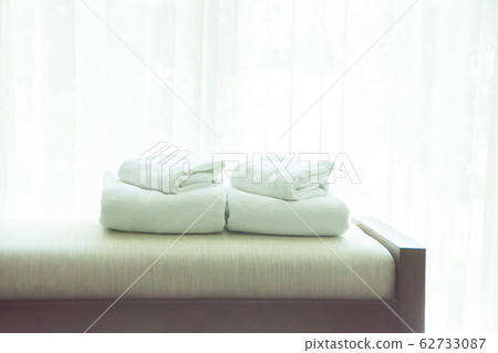 White Towels Were Laid On Sofa By The Window, With White Towels Were Laid On Sofa By The Window, With 62733087
