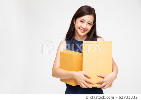 Happy Asian woman holding package parcel box, 62733332