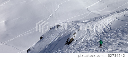 Skier on off-piste slope 62734242