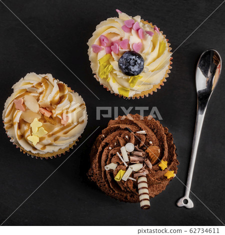 Three different cupcakes top view Three different cupcakes top view 62734611