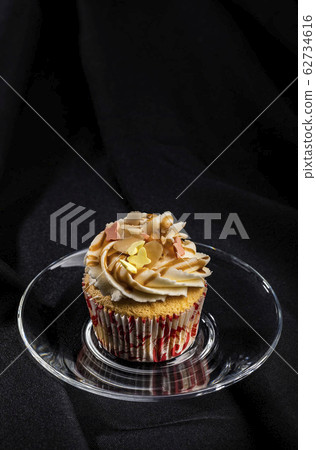 Vanilla cupcake, isolated Vanilla cupcake, isolated 62734616