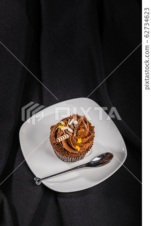 Brown cupcake top view 62734623