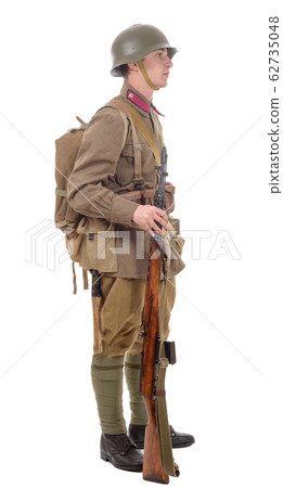 young Soviet soldier with rifle on the white young Soviet soldier with rifle on the white 62735048