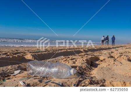 Plastic bottle on the beach, pollution Plastic bottle on the beach, pollution 62735050
