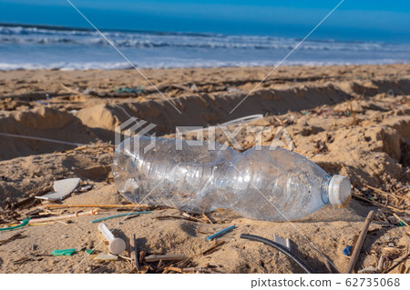 Plastic bottle on the beach, pollution Plastic bottle on the beach, pollution 62735068