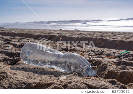 Plastic bottle on the beach, pollution Plastic bottle on the beach, pollution 62735081