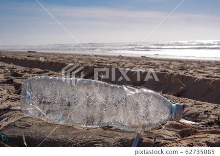 Plastic bottle on the beach, pollution Plastic bottle on the beach, pollution 62735085