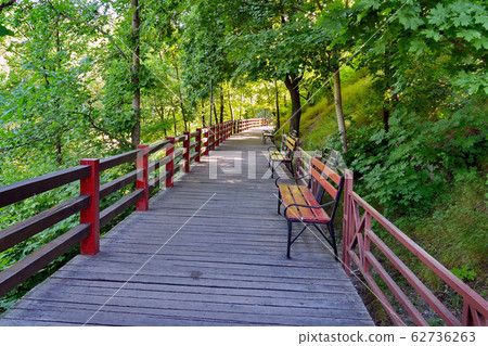 long twisted track in the middle of grassy slopes long twisted track in the middle of grassy slopes 62736263