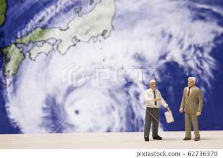 Men discussing typhoon 62736370