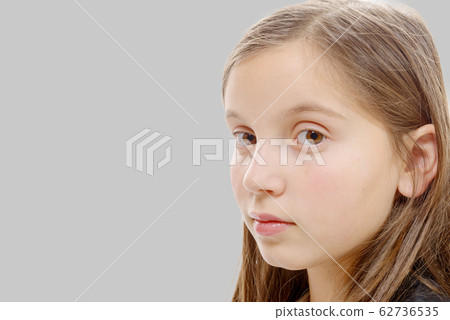 portrait of pre teenage girl isolated on grey portrait of pre teenage girl isolated on grey 62736535