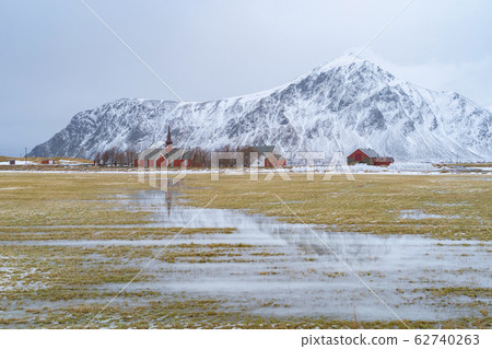 A church building and tomb grave with grass in A church building and tomb grave with grass in 62740263