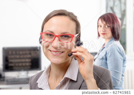 Close-up portrait of smiling young woman with 62741981