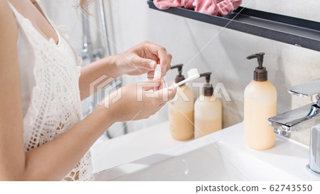 Dental care. Woman hands is holding toothbrush Dental care. Woman hands is holding toothbrush 62743550