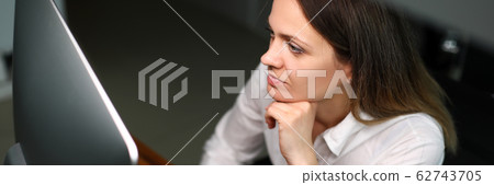 Concentrated woman at workspace 62743705