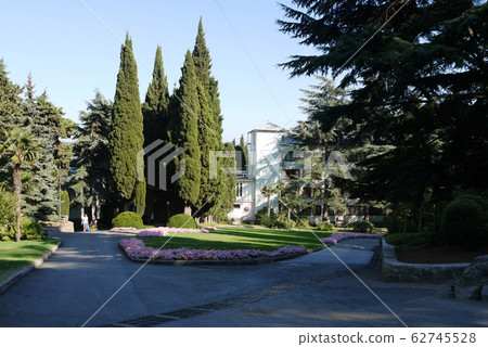 beautiful park with alleys near the hotel. The eye beautiful park with alleys near the hotel. The eye 62745528