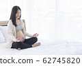 Asian Pregnant doing  yoga 62745820