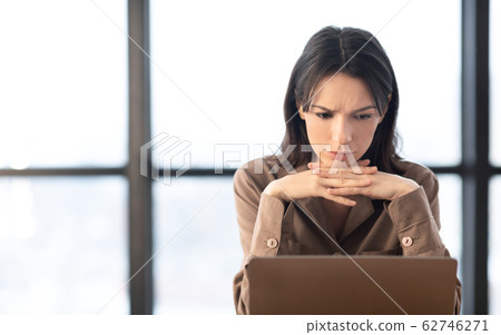 European manager sitting at desktop at modern office 62746271