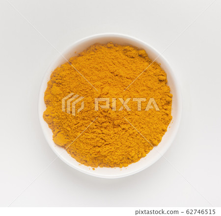 Closeup turmeric or curcumin powder in bowl Closeup turmeric or curcumin powder in bowl 62746515