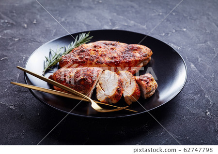 Restaurant serving of chicken breasts with spices 62747798