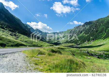 Landscape with a dirt road in U-turn in the Landscape with a dirt road in U-turn in the 62748136