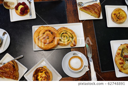 Top view on the table with pies, cakes and bun 62748891