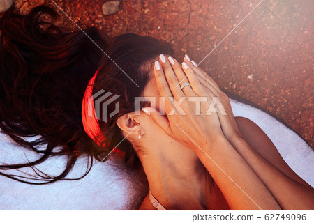 Close-up of a girl with stunning dark hair 62749096