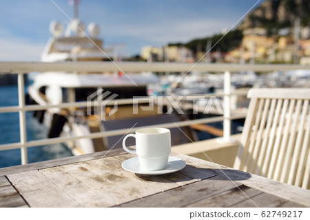 Cup of coffee on a wooden table on balcony hotel 62749217