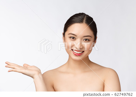 Beautiful smiling woman isolated on white background. Closeup lady portrait looking happy. Beautiful smiling woman isolated on white background. Closeup lady portrait looking happy. 62749762