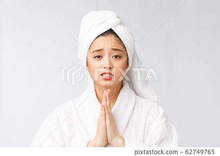 Beautiful women take care of skin health holding hand praying. Beautiful girl on white background. 62749765