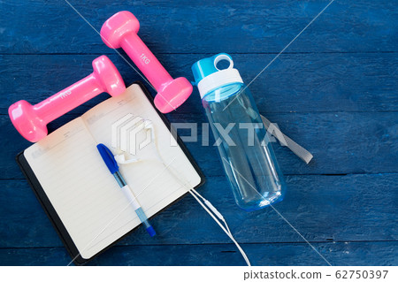 Top view notebook,headphones, water bottles, pink 62750397