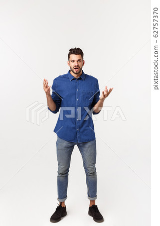 Charming handsome. Handsome young man in casual wear while standing isolated on white background 62757370