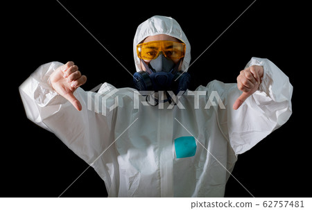 Woman in a chemical protective clothing and antigas mask with yellow glasses at white background Woman in a chemical protective clothing and antigas mask with yellow glasses at white background 62757481
