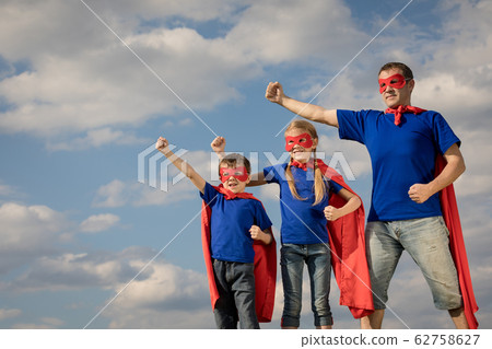 Father and children playing superhero at the day 62758627