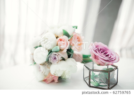 Beautiful wedding bouquet with different flowers, roses Beautiful wedding bouquet with different flowers, roses 62759765